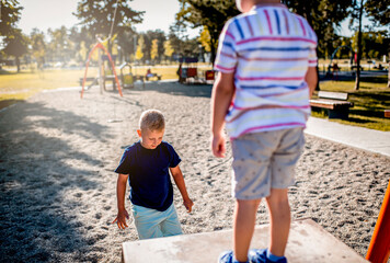 Children having fun with grandmother at the park