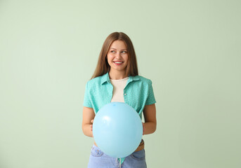 Sticker - Young woman with balloon on color background