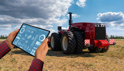 Aufkleber - A farmer with digital tablet controls an autonomous tractor on a smart farm