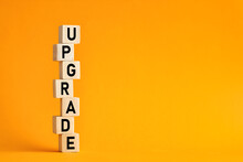 The Word Upgrade On Wooden Cubes. Computer, Network, Internet Business Technology Upgrade Concept.
