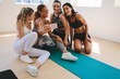 © Jacob Lund - Women taking a selfie after workout