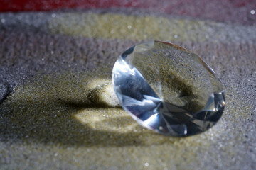 Sticker - Closeup shot of an amazing diamond on the sand