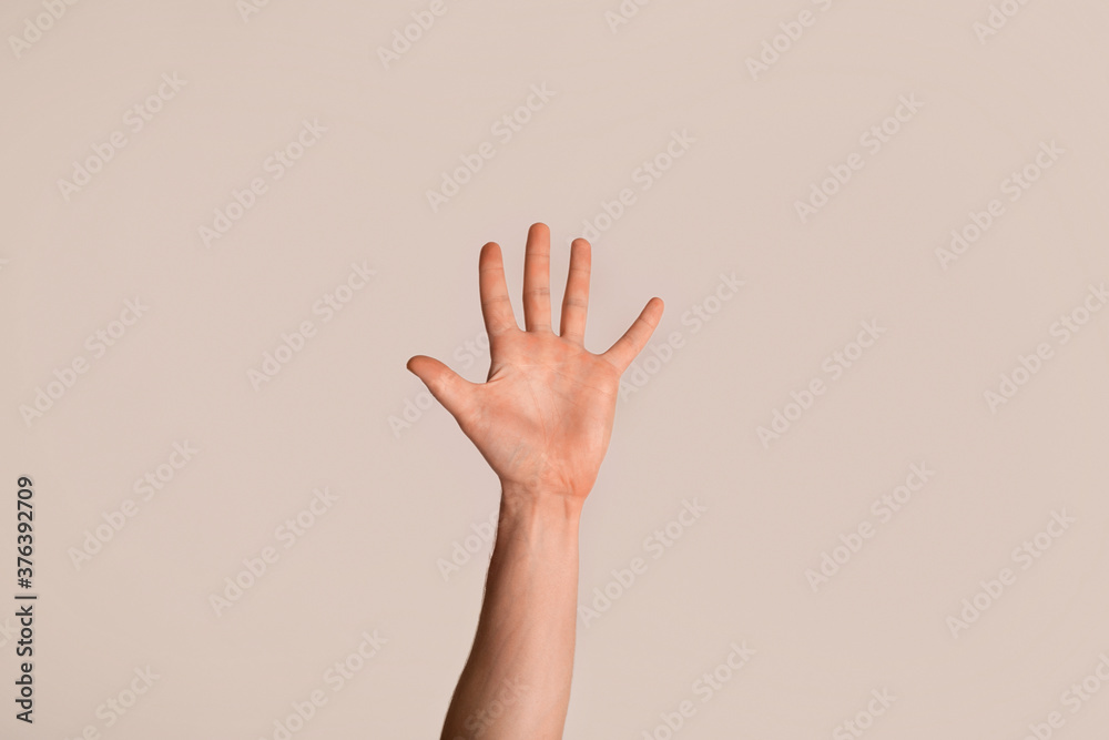 Young guy showing his hand with open palm, gesturing high five on light background, closeup - obrazy, fototapety, plakaty 