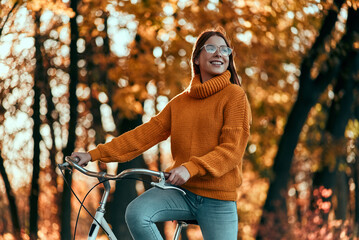 Wall Mural - Woman in park in autumn