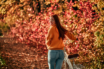 Wall Mural - Woman in park in autumn