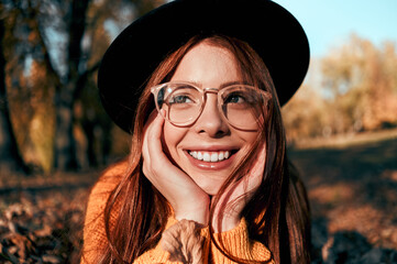 Wall Mural - Woman in park in autumn