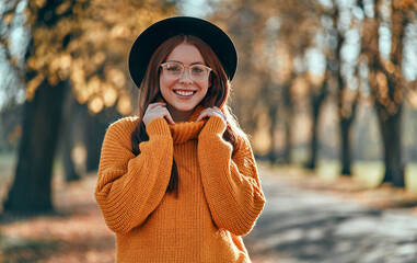 Wall Mural - Woman in park in autumn