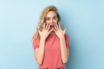 Canvas Print - Young blonde woman isolated on blue background with surprise facial expression