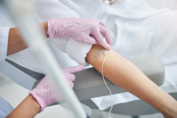 Wall Mural - Caucasian woman patient undergoing a medical procedure