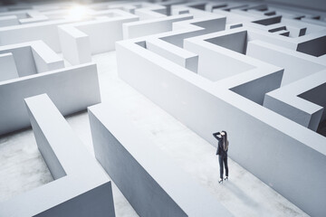 Poster - Young businesswoman in suit standing in concerete labyrinth.