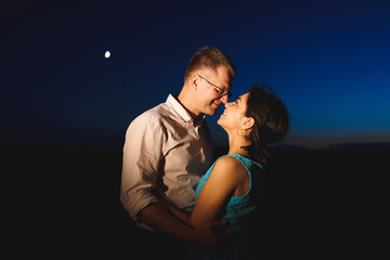 Poster - hugging couple and moon in sky