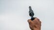© DZiegler - Hand holding a pistol to shoot into the air