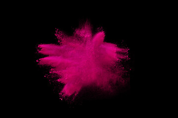 Wall Mural - Pink powder explosion on black background. Paint Holi.