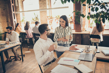 Poster - Photo of handsome business man pretty lady colleagues partners coffee break breakfast spacious big office drink hot beverage communicating successful teammates indoors