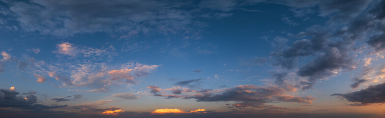 summer sunset sky panorama with fleece colorful clouds. evening dusk good weather natural background
