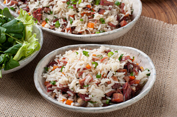 Arroz de Carreteiro - Typical food from southern Brazil, made with rice, dried meat, pepperoni sausage, bacon and carrots.