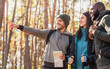 © Prostock-studio - Happy hikers found right way, holding map at forest