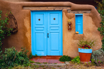 Blue door of Adobe House in New Mexico Southwest USA