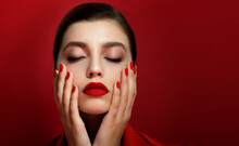 Portrait Of Beautiful Young Woman Wearing Red Clothes With Perfect Young Skin, Red Matt Lips And Nails.