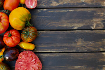 Poster - assortment of tomatoes on brown wooden surface