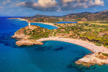 Torre di Chia view from flying drone. Acropoli di Bithia with Torre di Chia tower on background. Aerial view of Sardinia island, Italy, Europe. Panorama Of Chia Coast, Sardinia, Italy.