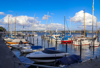 Wall Mural - Sailing ship mast against the blue sky on some sailing boats with rigging details.