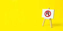 Easel With No Turning Back Traffic Sign On A Yellow Background. Assertiveness And Striving, Moving Forward Without Retreating. Go To The Goal, Don't Stop. Finish Things. There Is No Way Back.