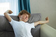 © alfa27 - sleepy curly redhead boy relax at home sitting sleepy in the morning, at home