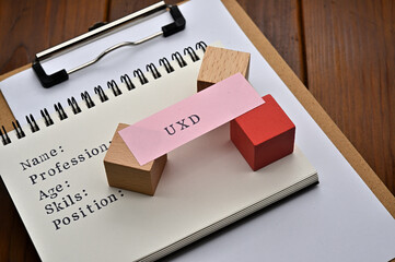 Poster - A note with the user's persona written on it is placed on a clipboard. A sticky note stamped with 