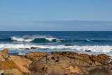 Fototapeta Morze - Huge  frothy waves of the Indian Ocean rolling in at famous Yallingup Beach,South Western Australia a world famous surfing mecca, on a cold yet sunny late winter morning.