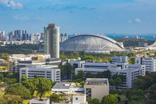 View Of The Singapore Sports Hub With Residential Areas And The Sea In The Background