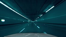 Fast Drive By Car Through A Tunnel In The Tenet Movie / Film Look, With Cyan, Light Bluish Color Tones. Following A Car From The Front Window View With A Speed Ramp Effect.