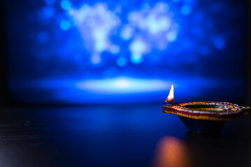 Wall Mural - Indian festival Diwali, Diya oil lamps lit on colorful rangoli. Hindu traditional. Happy Deepavali. Copy space for text.