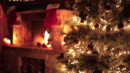 christmas decorated tree closeup with fireplace
