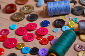 Poster - Background and texture of multicolored antique buttons and sewing tools