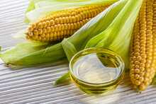 Corn Oil On White Wooden Rustic Background
