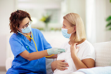 Doctor examining sick patient. Ill woman in clinic