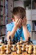 the boy was upset about losing a game of chess