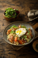 Canvas Print - Healthy warm bulgur salad with poached egg