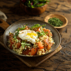 Canvas Print - Healthy warm bulgur salad with poached egg