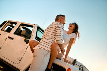 Poster - Couple on beach with car