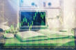 © peshkova - Multi exposure of graph and financial info and work space with computer background. Concept of international online trading.