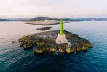 A Large Metal Green Lighthouse On A Rock In The Sea, Near Cape Punta Planka In Croatia. 