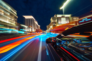 Wall Mural - View from Side of Car moving in a night city, Blured road with lights with car on high speed. Concept rapid rhythm of a modern city.