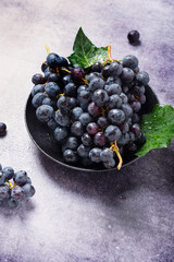 Canvas Print - Sweet fresh black grape on the dark table