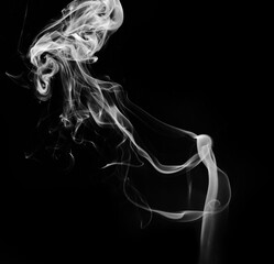 abstract fragment movement of white smoke on black background.