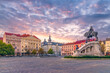 Cluj-Napoca city center. View from the Unirii Square to the Rhedey Palace, Matthias Corvinus Monument and New York Hotel at sunset on a beautiful day