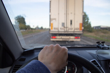 Overtaking a car . Travel by car. Dangerous maneuver.