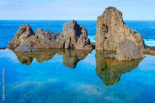 Ocean bathes lava pools Mad...