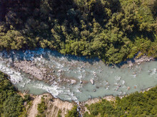 Aerial View Of Whitewater Rapids In River In Swiss Alps. Wild Water From Above In Nature.